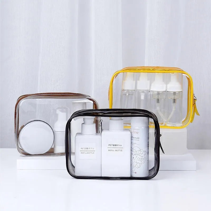 Three semi-transparent PVC makeup bags in black, pink and white colours showing cosmetic storage