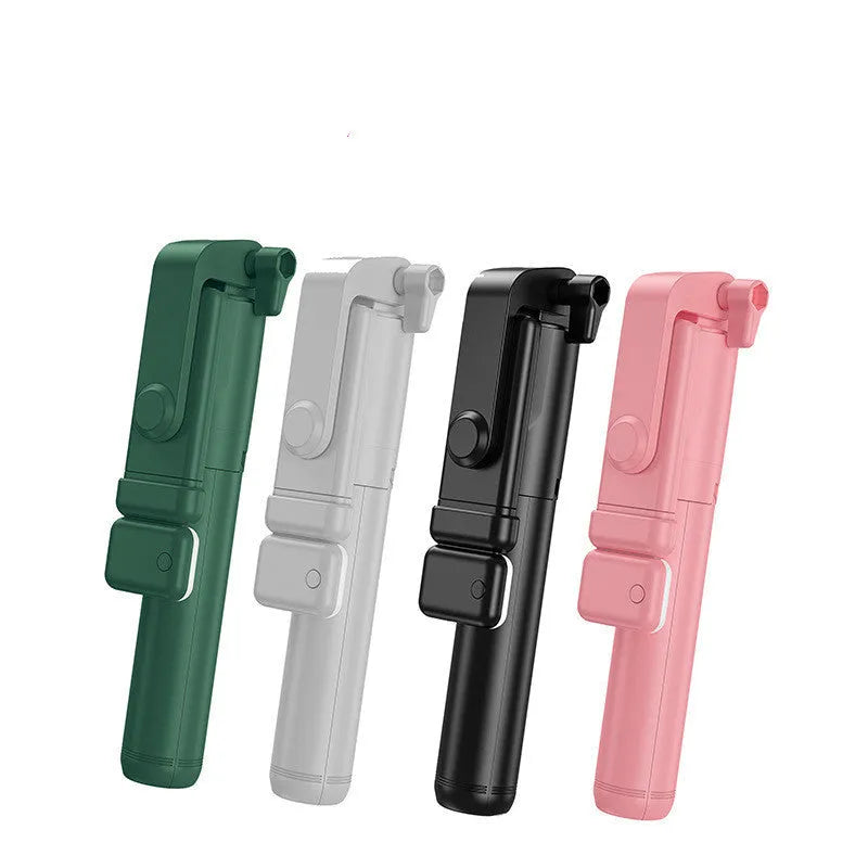 Black aluminium Bluetooth selfie stick with extended tripod legs and a phone mounted in the 360-degree rotating holder.