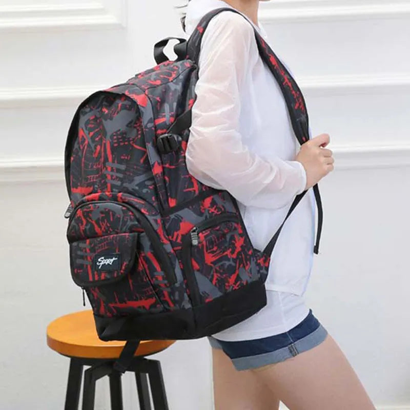 Blue and red classic nylon backpack with large main compartment for school and travel.