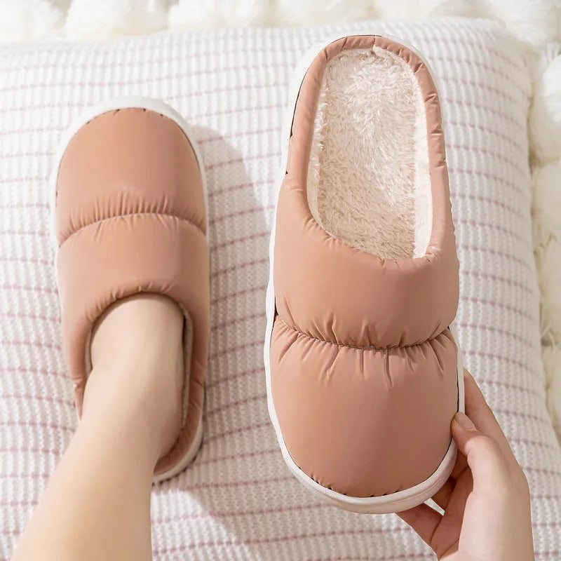 A pair of down cotton indoor slippers with a thick rubber sole and plush lining, shown in a choice of colours.