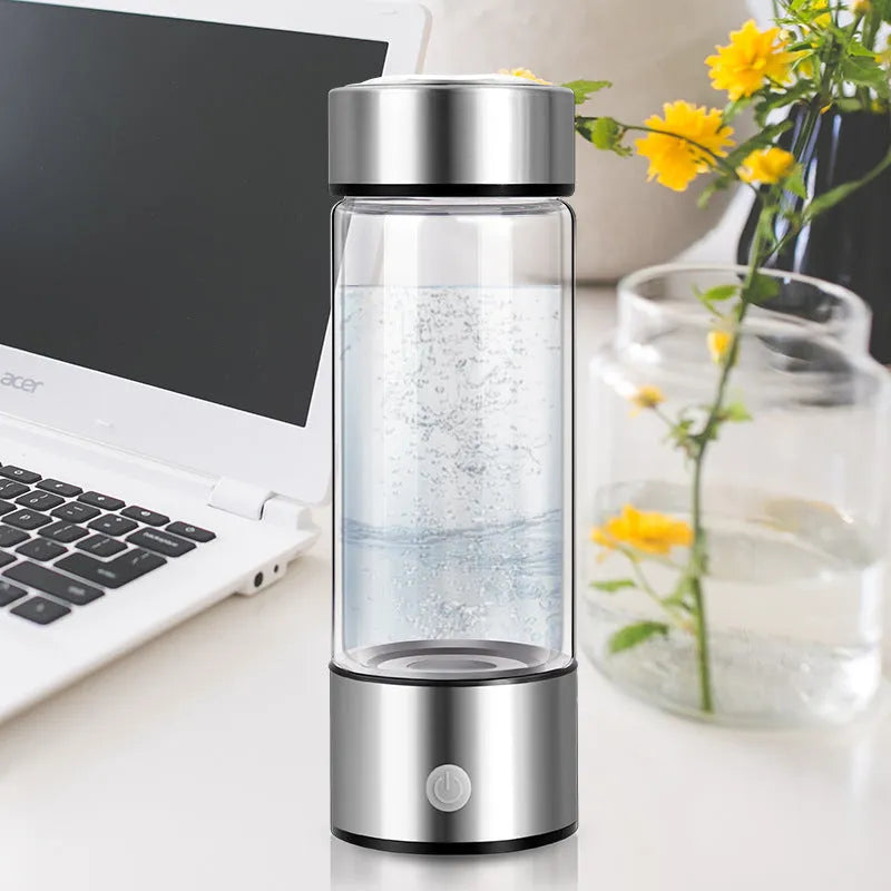 Silver hydrogen water bottle with borosilicate glass construction and electric hydrogen generator