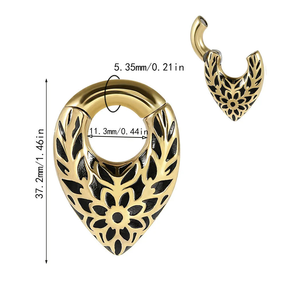 Stainless steel ear extender with egg-shaped auricle and totem design for earlobe stretching.