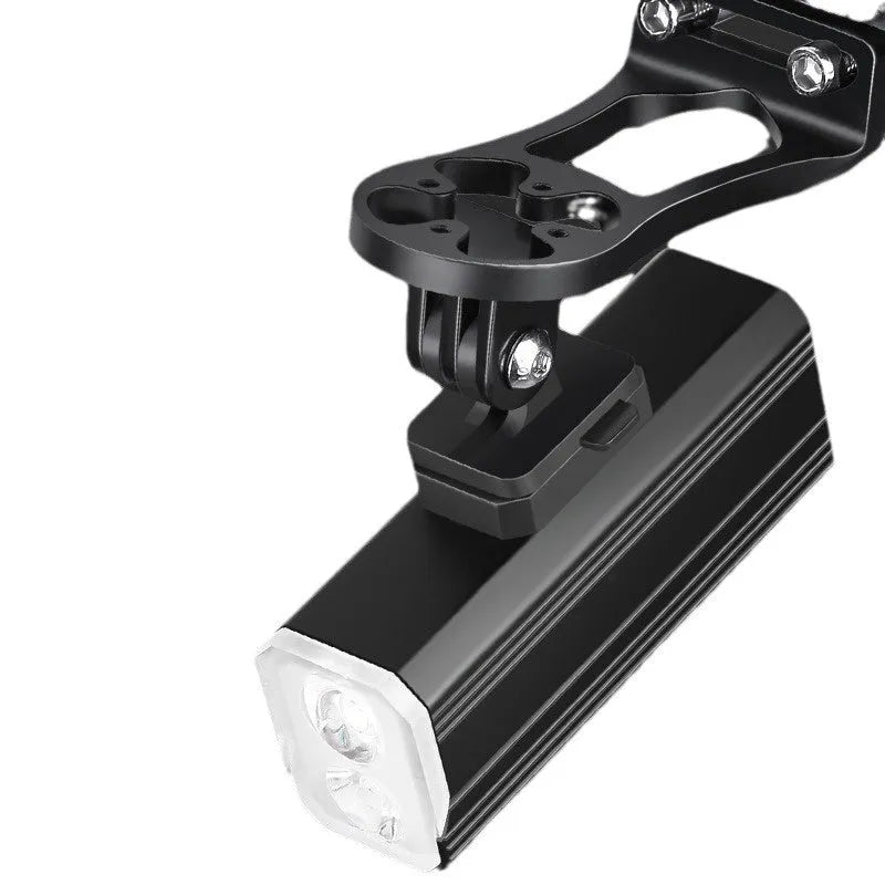 Aluminium alloy mountain bike headlight with silicone mounting bracket, showing scale and TPYE-C charging port.