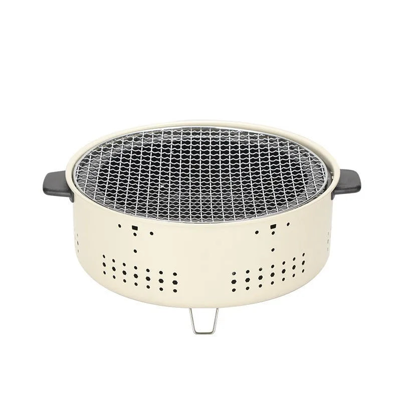 Portable indoor charcoal cooking stove with grill rack, modern design for tabletop use.