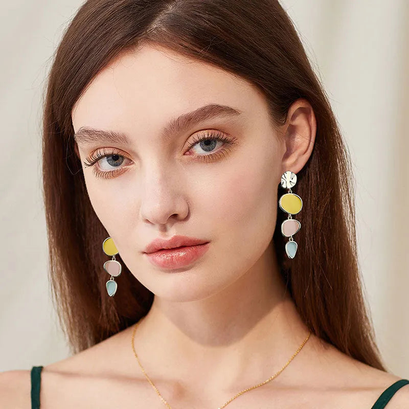 Morandi three-colour oil drip finish on disc-shaped alloy earrings with sterling silver post.