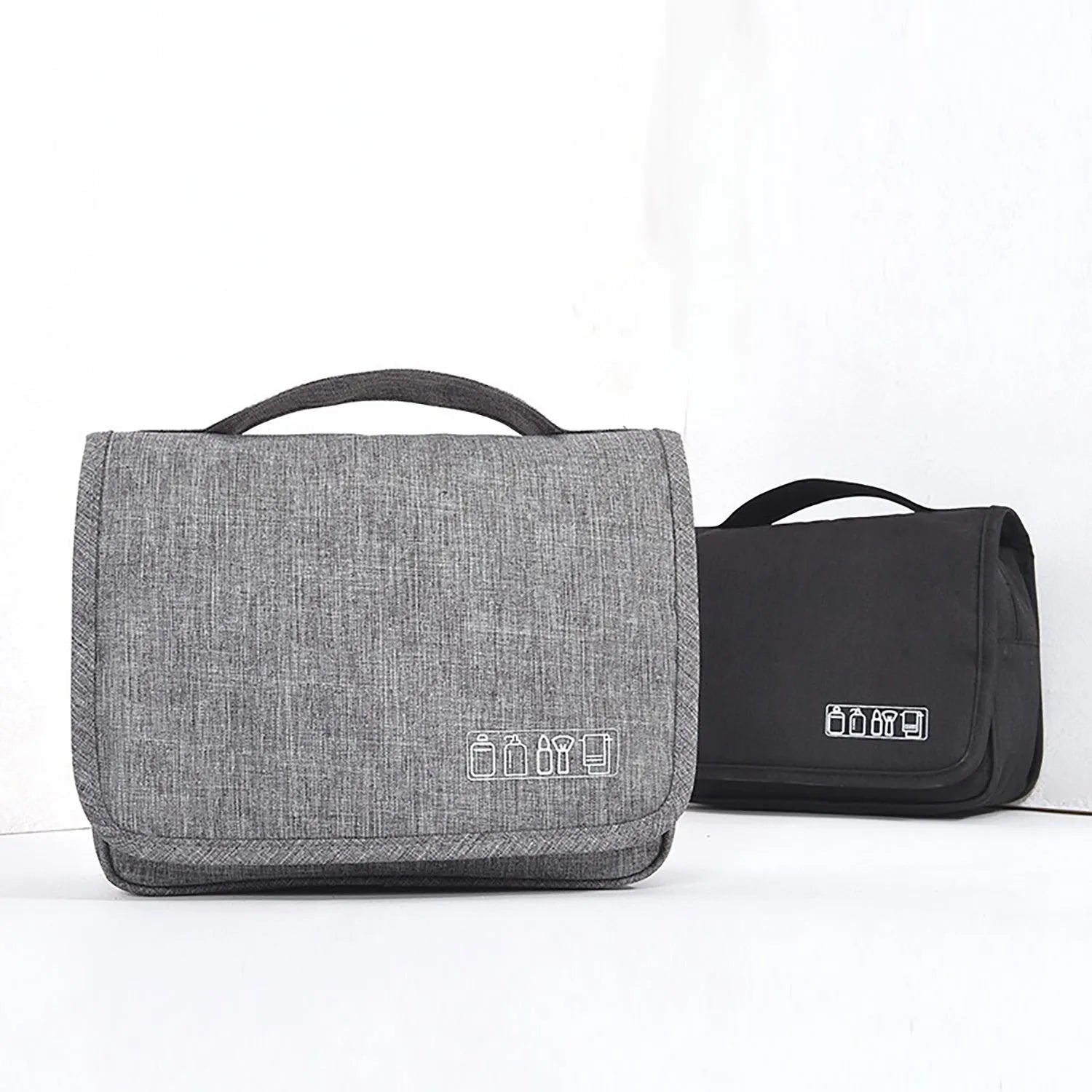Large waterproof hanging toiletry bag in black with four compartments and metal hook