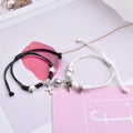 Magnetic couple bracelet set with electroplated alloy construction and various charm designs