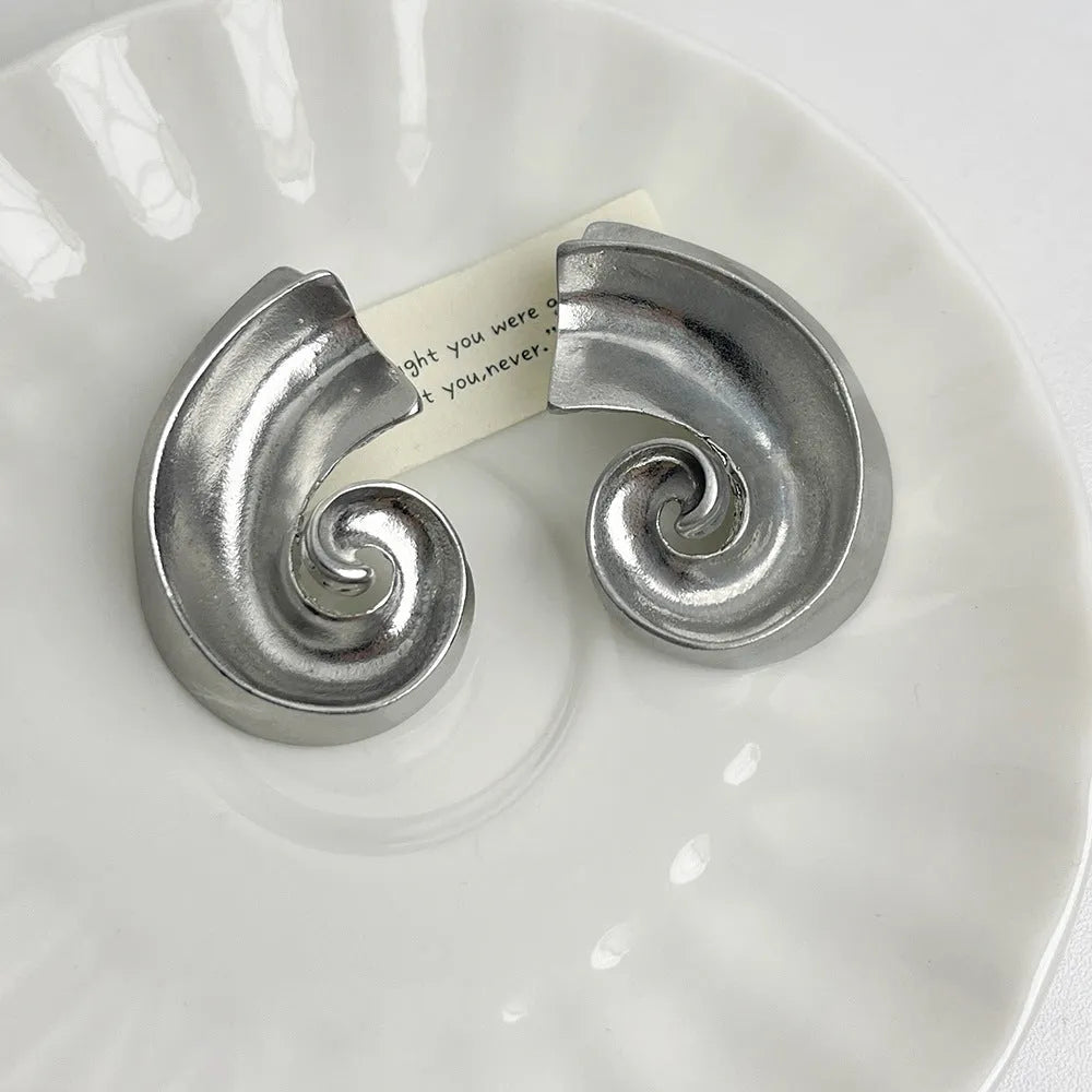 Retro geometric ear studs in gold or silver finish measuring 5cm with alloy construction