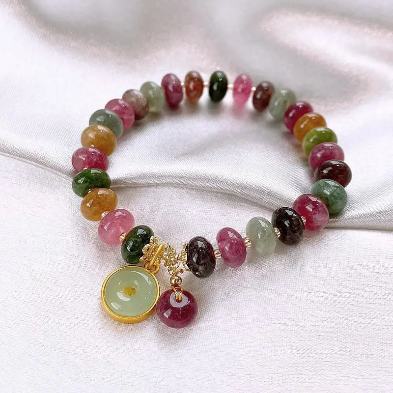 Natural stone abacus bead bracelet with a colourful tourmaline rabbit pendant.