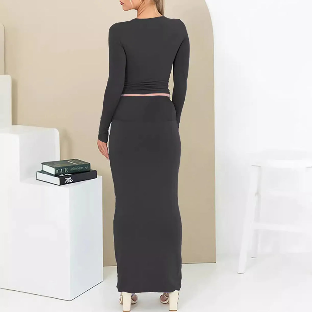 Women's black crop top and long skirt two-piece set with three-quarter sleeves and exposed navel design