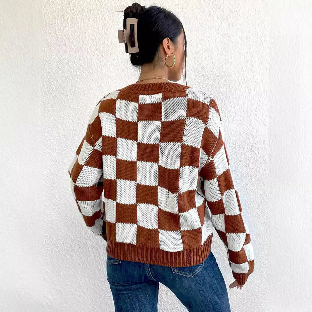 Dark brown plaid women's loose pullover sweater with round neck and long sleeves.