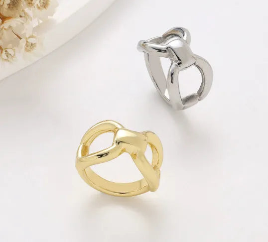 Women's titanium steel hollow butterfly bow ring with geometric design in gold or steel colour