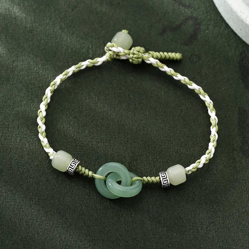 Women's green and copper ethnic-style bracelet with jade buckle weaving and a peace buckle charm.