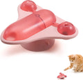 Blue interactive pet puzzle toy with airplane cabin snack dispenser, bell, and catnip on a suction cup base