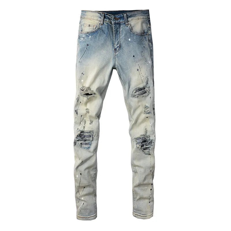 Men's blue light coloured paint splashing ink making old washed denim jeans with small straight leg and zip fly