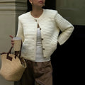 White women's long sleeve button shirt sweater made from polyester, front view