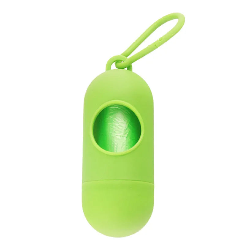 Black dog poop bag holder with side hook and Velcro closure, showing compact size.