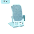 Cyan wireless charging metal desktop stand with aviation aluminium alloy body holding a smartphone upright
