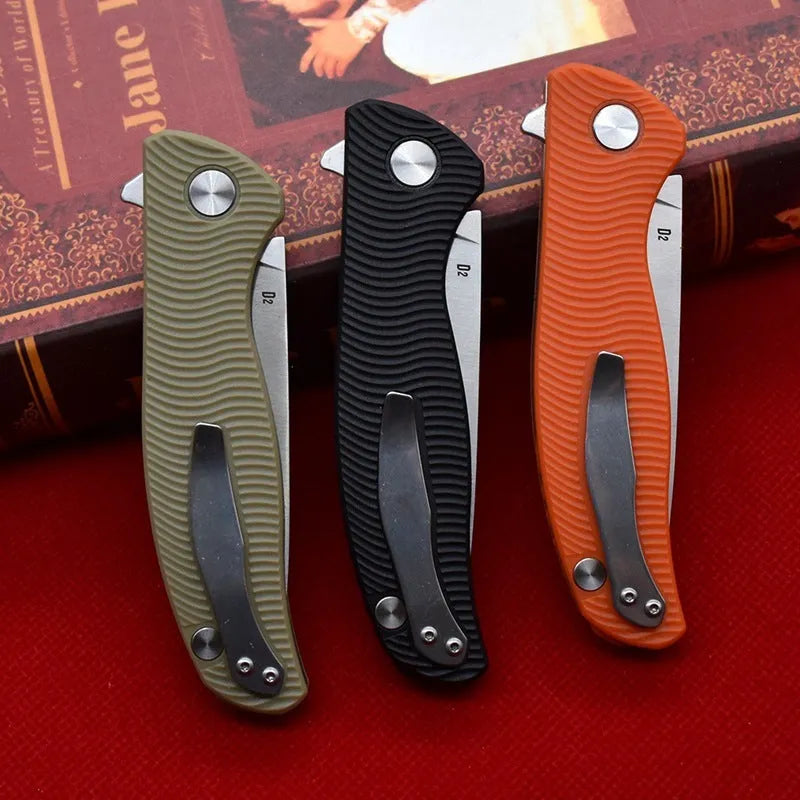 Outdoor folding knife with D2 steel blade, 9.6 cm blade length, 4.0 mm edge thickness, and nylon glass fibre handle in Black or Orange