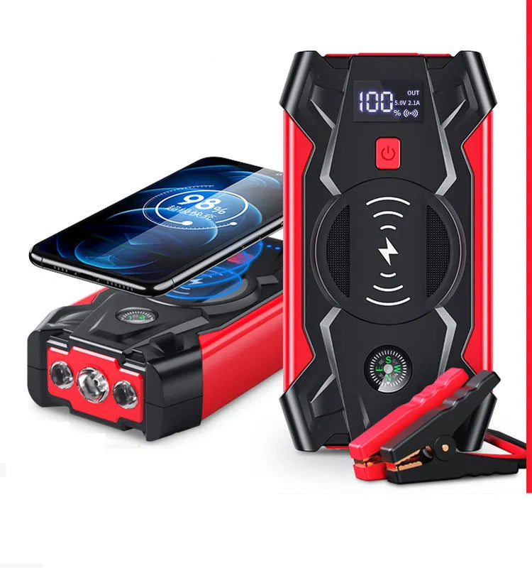 Red 12V car battery jump starter power pack with battery clips on a black background.