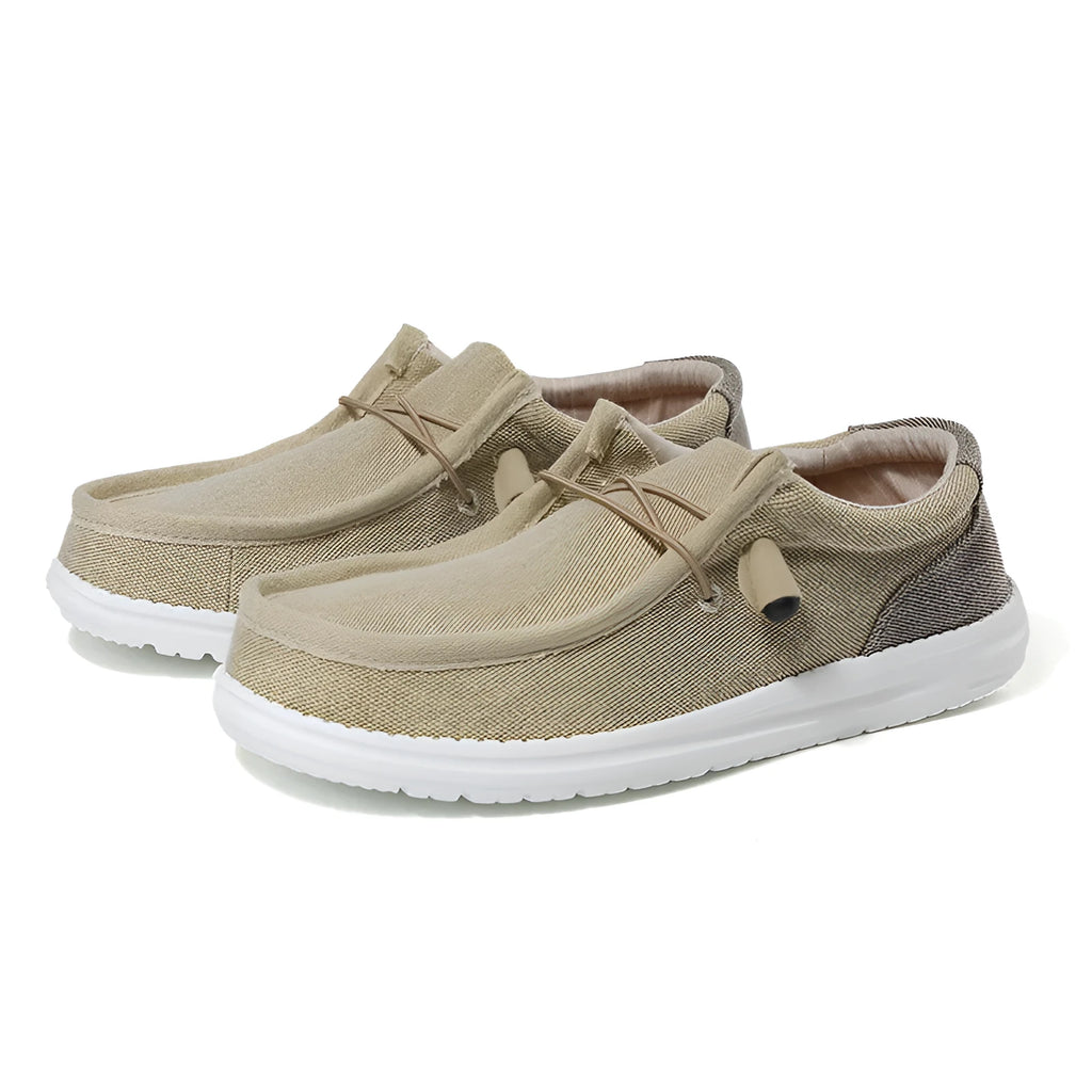 Men's casual canvas shoe in green with mosaic detail and rubber sole, shown from the side.