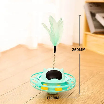 Pink cat tumbler turntable toy with feather attachments on rotation platform