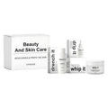 Beauty And Skin Care set with firming facial essence, skin firming milk, and anti-wrinkle cream in individual bottles