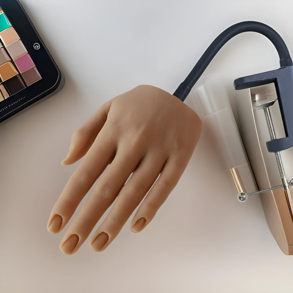 Silicone nail art practice hand model showing articulated fingers with nail beds in one of six skin tone colours