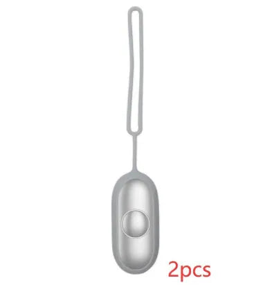 Hand-held micro-current sleep aid device with round button and USB charging port