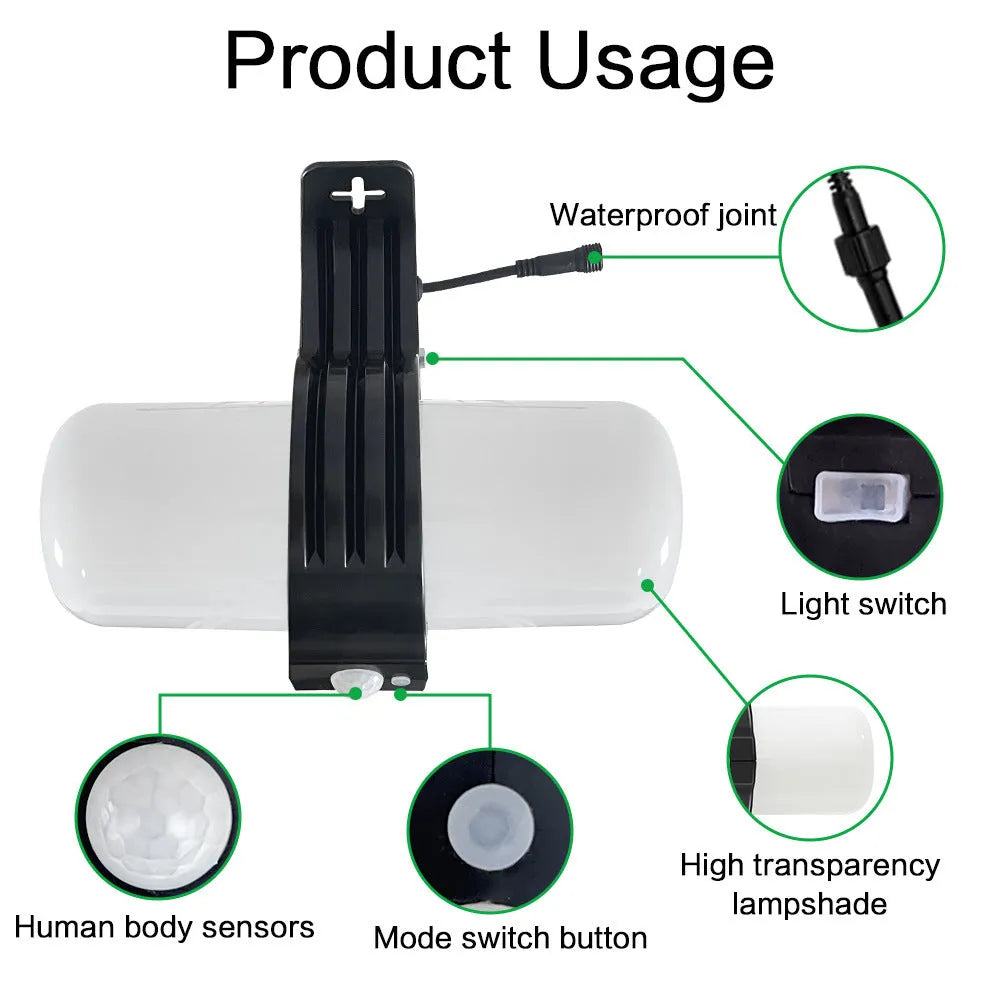 Black outdoor solar motion sensor floodlight with abstract design mounted on a wall bracket.