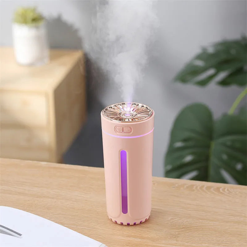 Black USB car humidifier with LED lights placed in vehicle cup holder showing mist output