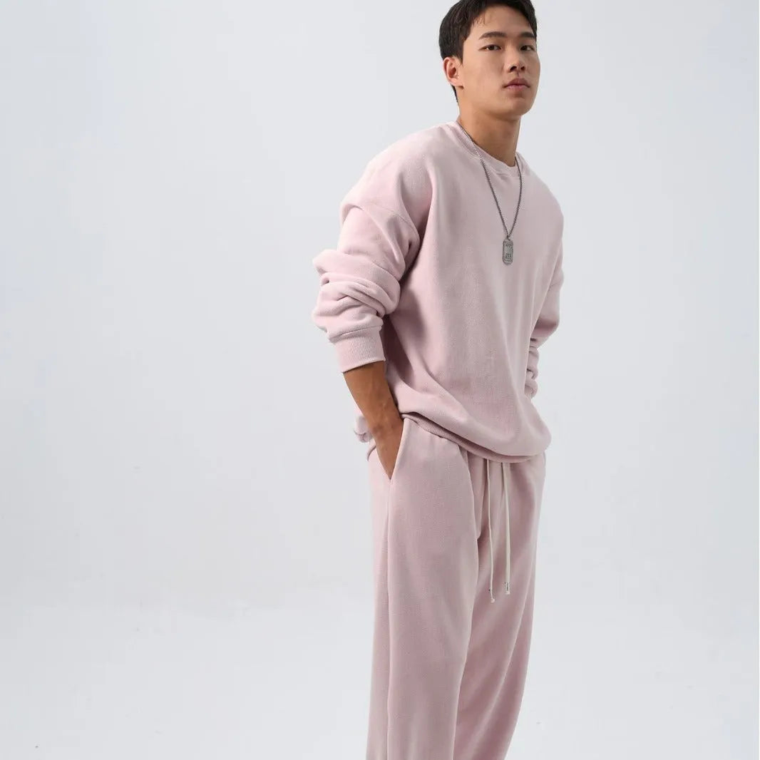 Men's black polar fleece winter sports suit with loose fit long sleeve coat and matching trousers