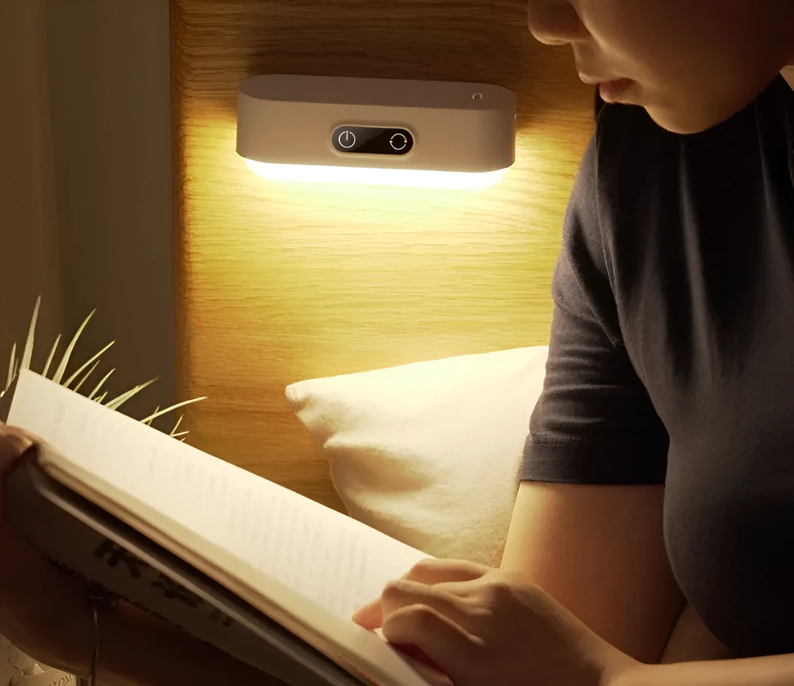 White magnetic USB rechargeable LED night light with touch controls mounted on a metal surface.