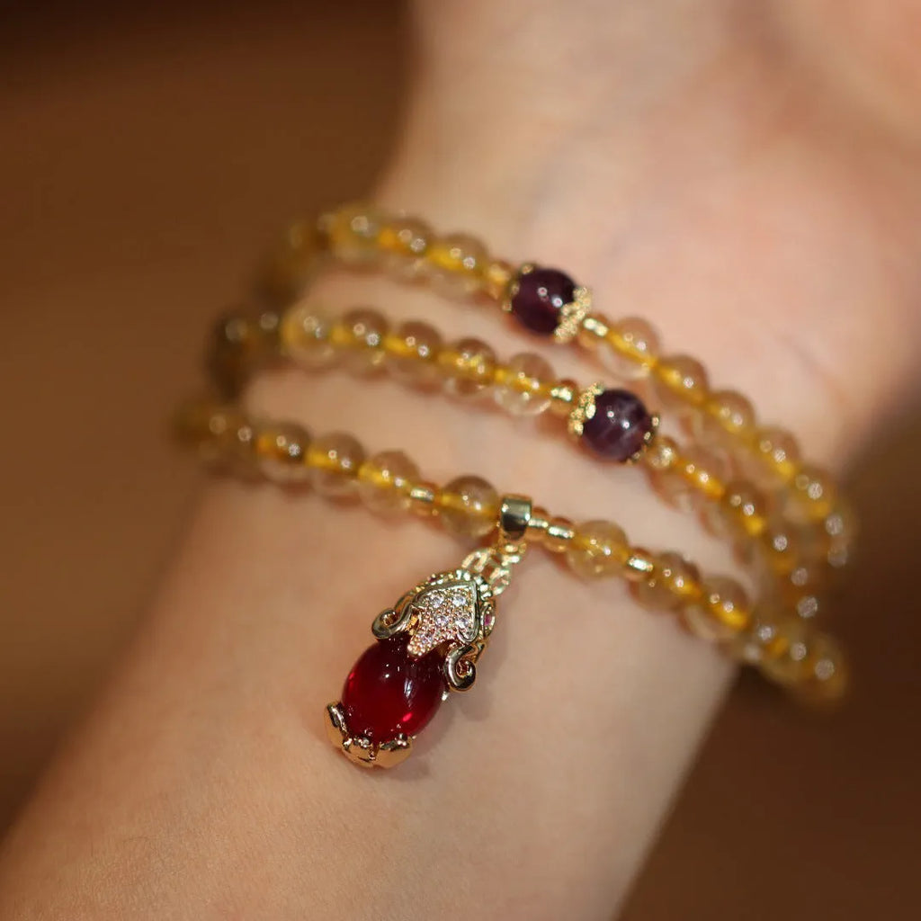 Natural Brazil gold rutilated quartz bracelet with Chinese style design and three gold rings
