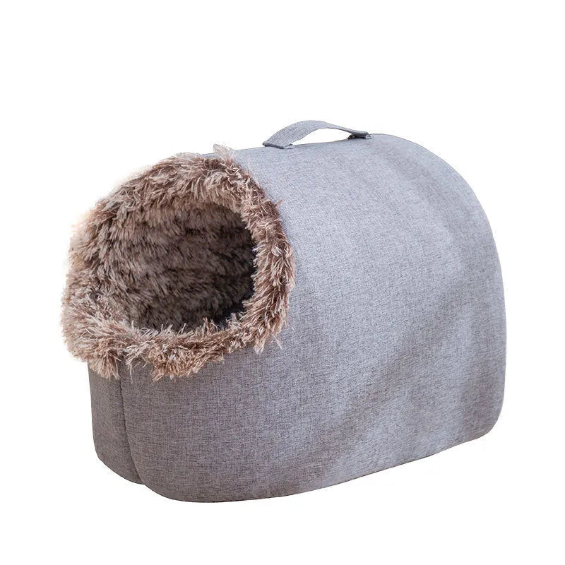 Grey fleece-lined closed cat sleeping bag bed showing enclosed nest design for winter warmth.