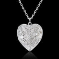 Carved heart photo frame pendant necklace in alloy showing a personal photo inside