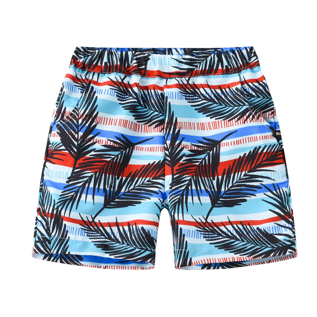 Children's elastic waist beach shorts with colourful coconut tree print, shown in shorts length.