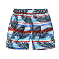 Children's elastic waist beach shorts with colourful coconut tree print, shown in shorts length.
