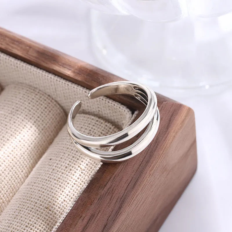 Women's retro copper double layer hollow geometry ring with adjustable opening.