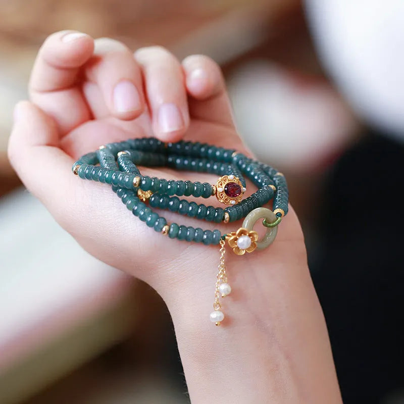 Women's blue water jade abacus beads bracelet with three tourmaline rings and pearl accents