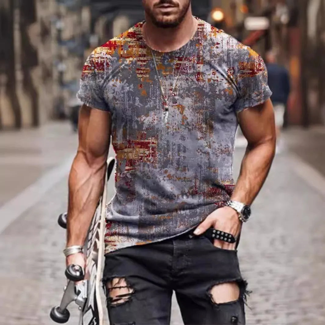 Man wearing a loose-fit camouflage print short-sleeved t-shirt.