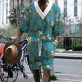Men's peacock blue knitted shorts and T-shirt leisure suit set on a white background