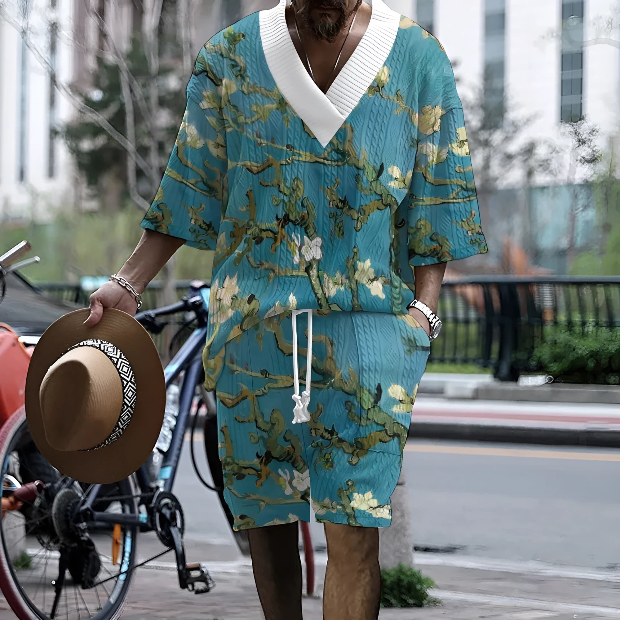Men's peacock blue knitted shorts and T-shirt leisure suit set on a white background