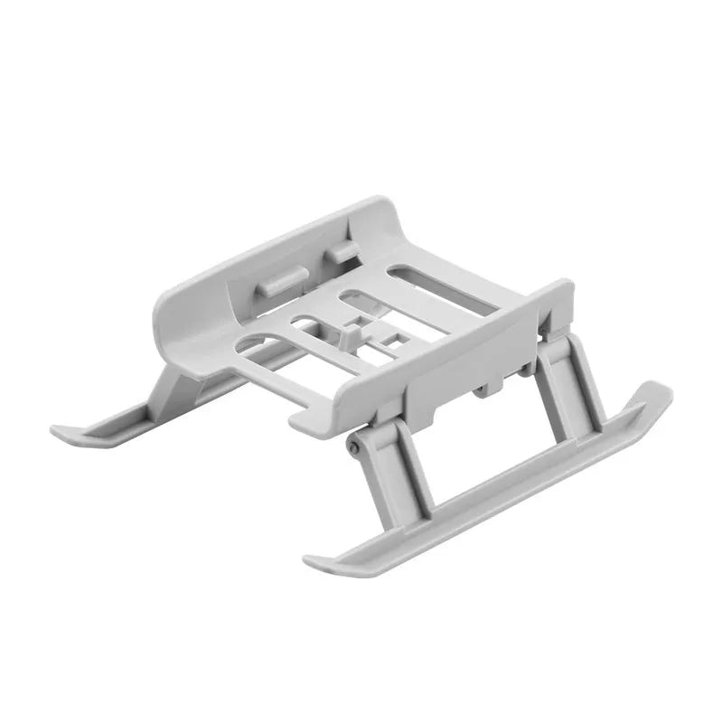Grey plastic folding UAV landing gear monopod tripod unfolded on a table