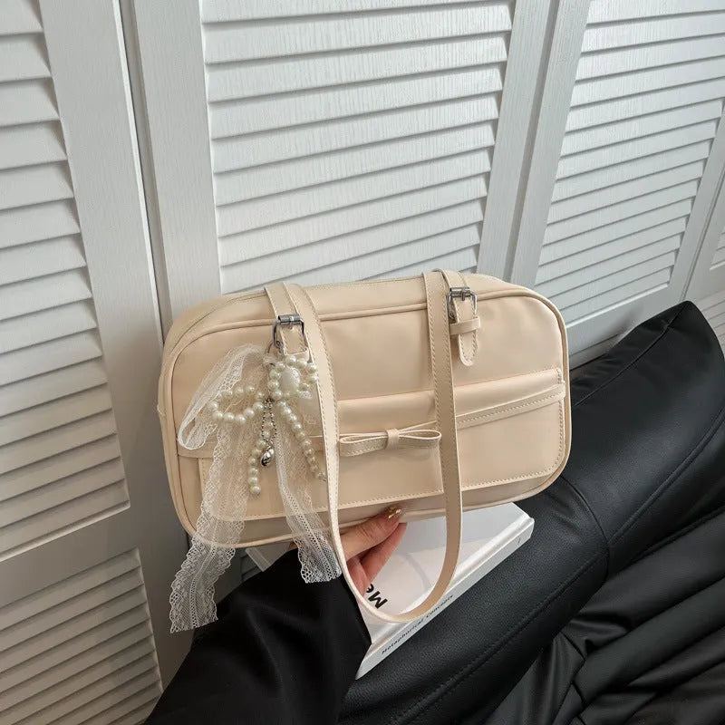 Women's black PU leather single-shoulder bag with flap closure and double straps showing internal mobile phone compartment