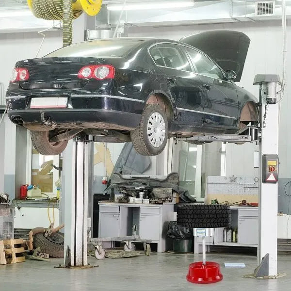 Portable wheel hub balancer with aluminium head and bull's eye level on an enamel base.
