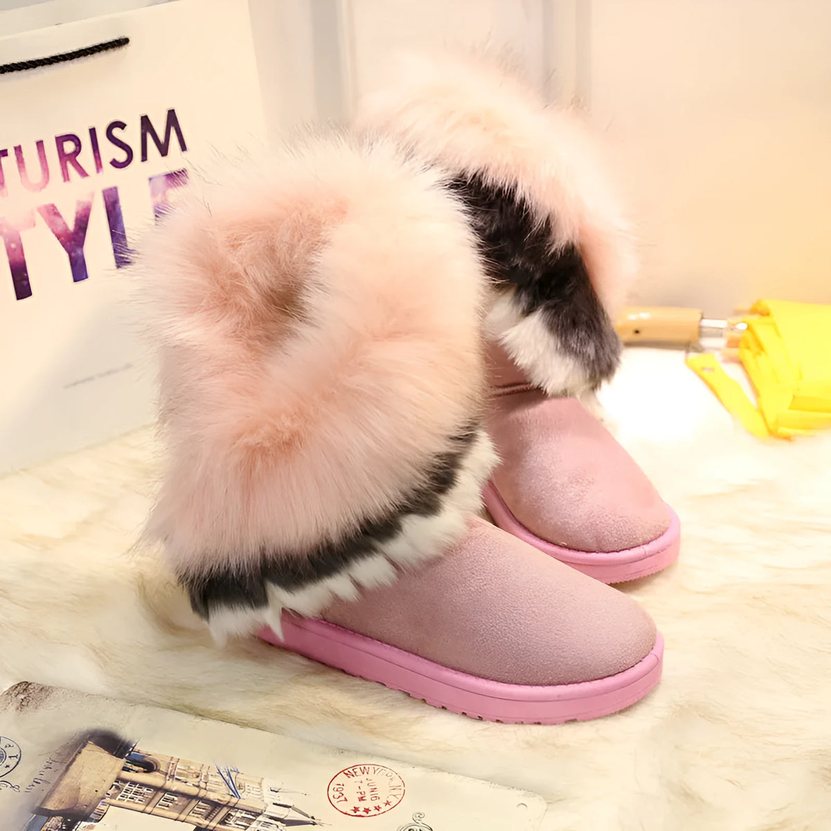 Women's winter snow boots with suede upper, fluffy fox fur trim, and non-slip rubber sole in black colour