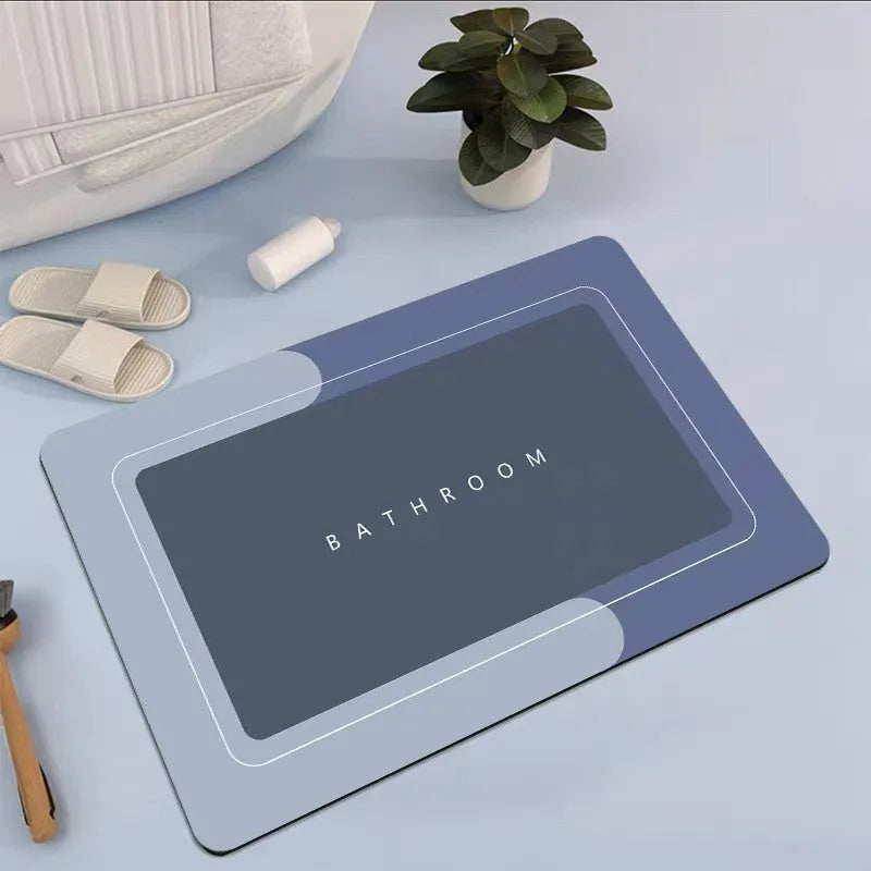Diatom mud absorbent bathroom floor mat in blue rectangular shape on tiled floor
