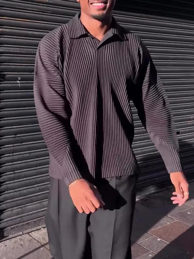 Black men's long-sleeved casual top with pleated detail on the sleeves.