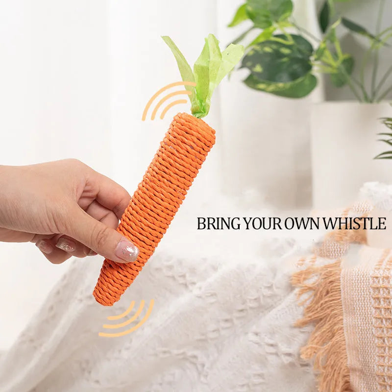 Cat toy set with carrot-shaped paper bites, ringing stones, and grinding sticks on soft surface